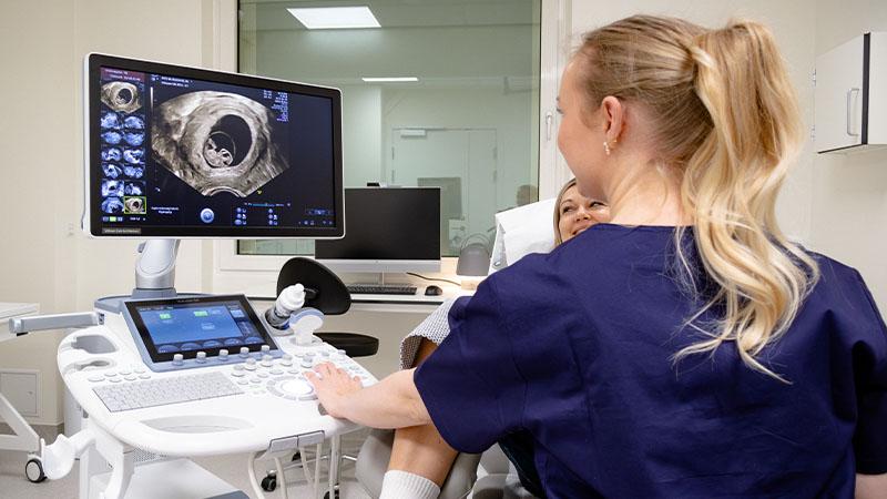 Fertility nurse scanning a patient